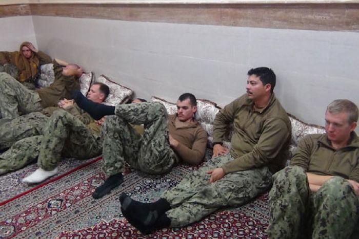 American soldiers rest after release.